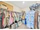 Spacious walk-in closet with ample hanging space and shelving at 14716 Crescent Rock Dr, Wimauma, FL 33598