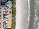 Stunning aerial view of the building, ocean and beach at 15000 Gulf Blvd # 407, Madeira Beach, FL 33708
