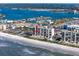 Gorgeous aerial shot highlighting oceanfront condo building with a pool and private beach access at 15000 Gulf Blvd # 407, Madeira Beach, FL 33708
