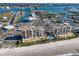 Impressive aerial perspective showing the beachfront condo complex, its prime location, and stunning coastal surroundings at 15000 Gulf Blvd # 407, Madeira Beach, FL 33708