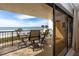 Comfortable balcony featuring four seats and views of the ocean and sandy beach at 15000 Gulf Blvd # 407, Madeira Beach, FL 33708