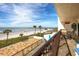 Enjoy stunning ocean views from this expansive balcony featuring dining and seating areas at 15000 Gulf Blvd # 407, Madeira Beach, FL 33708