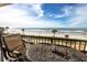 Balcony area showcasing comfortable seating with scenic views of the beach and ocean at 15000 Gulf Blvd # 407, Madeira Beach, FL 33708