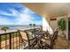 Relaxing balcony with seating and ocean views, perfect for enjoying the beach breeze and sunshine at 15000 Gulf Blvd # 407, Madeira Beach, FL 33708
