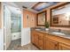 A bathroom with double sinks, granite countertops, and a separate shower and tub area at 15000 Gulf Blvd # 407, Madeira Beach, FL 33708