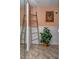 The bathroom features tile flooring, a plant, and a bamboo ladder near the shower at 15000 Gulf Blvd # 407, Madeira Beach, FL 33708
