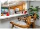 Cozy breakfast nook with seating, a large window, and kitchen access at 15000 Gulf Blvd # 407, Madeira Beach, FL 33708
