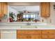 Kitchen passthrough with bright countertop and sink overlooking the living room at 15000 Gulf Blvd # 407, Madeira Beach, FL 33708