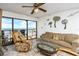 Comfortable living room with sliding glass doors to a balcony with ocean views at 15000 Gulf Blvd # 407, Madeira Beach, FL 33708