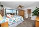 Serene bedroom featuring ocean views from the balcony, offering a peaceful coastal retreat at 15000 Gulf Blvd # 407, Madeira Beach, FL 33708