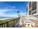 Inviting patio with ocean views, seating, and easy access to the beach, ideal for outdoor relaxation at 15000 Gulf Blvd # 407, Madeira Beach, FL 33708