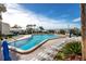 Sparkling community pool with plenty of lounge chairs and ocean views, creating a resort-style experience at 15000 Gulf Blvd # 407, Madeira Beach, FL 33708