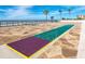 Fun shuffleboard court with ocean views, offering a playful amenity in a serene coastal setting at 15000 Gulf Blvd # 407, Madeira Beach, FL 33708