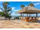 Charming tiki bar with seating overlooking the ocean, perfect for enjoying sunset cocktails and tropical breezes at 15000 Gulf Blvd # 407, Madeira Beach, FL 33708