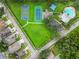 Overhead view of community park featuring a playground, pool, and tennis and basketball courts at 15709 Leatherleaf Ln, Land O Lakes, FL 34638