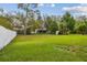 Spacious backyard with lush green grass and privacy fence; ideal for outdoor activities at 15709 Leatherleaf Ln, Land O Lakes, FL 34638