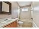 Cozy bathroom featuring tiled shower and decorative mirror at 15709 Leatherleaf Ln, Land O Lakes, FL 34638