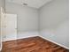 Bedroom featuring laminate floors and a doorway at 15709 Leatherleaf Ln, Land O Lakes, FL 34638