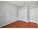 Comfortable bedroom with laminate flooring and closet space at 15709 Leatherleaf Ln, Land O Lakes, FL 34638