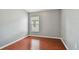 Clean bedroom with laminate flooring and natural light at 15709 Leatherleaf Ln, Land O Lakes, FL 34638