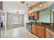 Well-lit kitchen with oak cabinets, stainless steel appliances, and a cozy dining nook at 15709 Leatherleaf Ln, Land O Lakes, FL 34638