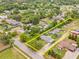 Aerial view of the property displaying the home, surrounding trees, and lot lines at 1607 Bell Shoals Rd, Brandon, FL 33511