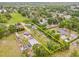 Expansive aerial view of property's layout, highlighting the home, surrounding greenery, and lot boundaries at 1607 Bell Shoals Rd, Brandon, FL 33511