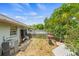 Backyard with a partial view of the pool and lots of space for enjoyment and shade trees at 1607 Bell Shoals Rd, Brandon, FL 33511