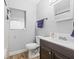 Updated bathroom features a new vanity, toilet, and hardwood floors at 1607 Bell Shoals Rd, Brandon, FL 33511
