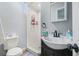 Bathroom features a new vanity, shower with white tile and white walls at 1607 Bell Shoals Rd, Brandon, FL 33511