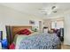 View of a bedroom with a zebra-patterned blanket and ceiling fan at 1607 Bell Shoals Rd, Brandon, FL 33511
