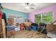 Spacious bedroom is being used for storage and features bright, colorful walls at 1607 Bell Shoals Rd, Brandon, FL 33511