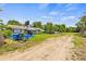 View of a home's exterior, yard and driveway with a basketball hoop at 1607 Bell Shoals Rd, Brandon, FL 33511