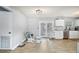 Bright kitchen features new wood floors, ample counter space, and access to the backyard at 1607 Bell Shoals Rd, Brandon, FL 33511
