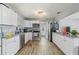 Updated kitchen features white cabinets, stainless steel appliances, and granite countertops at 1607 Bell Shoals Rd, Brandon, FL 33511