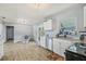 Updated kitchen features white cabinets, stainless steel appliances, granite countertops, and an eat-in area at 1607 Bell Shoals Rd, Brandon, FL 33511