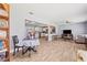 Open-concept living area featuring wood floors, a dining space, and seamless access to the kitchen at 1607 Bell Shoals Rd, Brandon, FL 33511