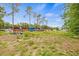 This property has an expansive, overgrown lawn with scattered debris and multiple structures at 1607 Bell Shoals Rd, Brandon, FL 33511
