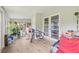 Enclosed sunroom features bright lighting and an access to the backyard at 1607 Bell Shoals Rd, Brandon, FL 33511