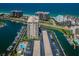 Aerial view of waterfront condo building offering boat docks and water views near the beach and local restaurants at 1621 Gulf Blvd # 407, Clearwater Beach, FL 33767