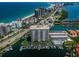 Aerial view of waterfront condo, beach, boat docks and water views of a luxury coastal community in Florida at 1621 Gulf Blvd # 407, Clearwater Beach, FL 33767