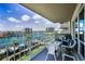 Enjoy this balcony with comfortable seating overlooking the beautiful water and boat docks at 1621 Gulf Blvd # 407, Clearwater Beach, FL 33767