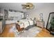 Spacious bedroom features a decorative ceiling fan, built in bookshelves, and a window seat overlooking the water at 1621 Gulf Blvd # 407, Clearwater Beach, FL 33767