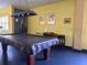 Community billiards room with a pool table and a vintage billiards light at 1621 Gulf Blvd # 407, Clearwater Beach, FL 33767