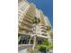 Modern high-rise building featuring multiple balconies and city views at 1621 Gulf Blvd # 407, Clearwater Beach, FL 33767