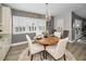 Charming dining area features a round table with four chairs and lots of natural light at 1621 Gulf Blvd # 407, Clearwater Beach, FL 33767
