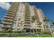 Beautiful condo exterior showcasing multiple balconies and a well-maintained green space at 1621 Gulf Blvd # 407, Clearwater Beach, FL 33767