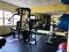 Well-equipped gym featuring weight machines, rubber flooring, and a large mirror for fitness enthusiasts at 1621 Gulf Blvd # 407, Clearwater Beach, FL 33767