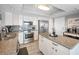 Modern kitchen featuring stainless steel appliances, granite countertops, and white cabinetry at 1621 Gulf Blvd # 407, Clearwater Beach, FL 33767