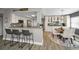 Open kitchen and dining area with bar seating and modern finishes at 1621 Gulf Blvd # 407, Clearwater Beach, FL 33767